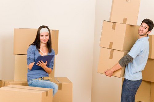 Packed moving boxes and furniture ready for house removals in Stmarycray
